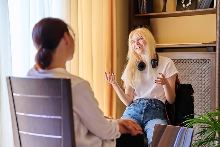 Teenage female in therapy session in psychologist's office