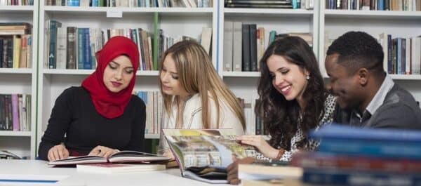 Group of students studying at university library